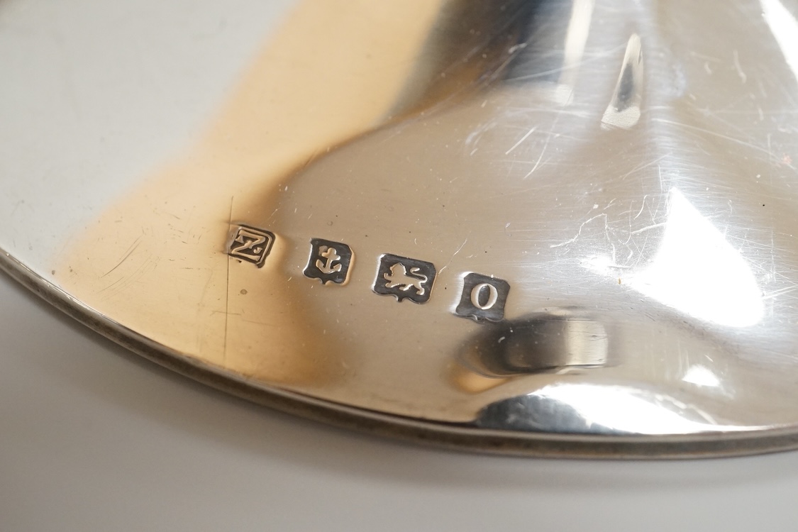 A George V silver mounted capstan inkwell, A & J Zimmerman Ltd, Birmingham, 1913, diameter 11.4cm, together with a small silver bowl, a small silver 'dish ring' salt(a.f.), a silver two handled bowl, a silver pill box an